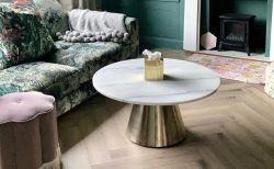 Modern grey laminate floor in open plan living and dining room